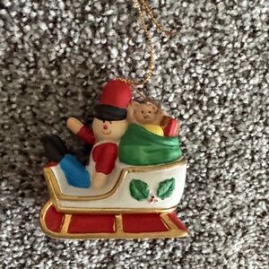 JSNY Porcelain Soldier - Festive Sleigh Ornament with Red and Green